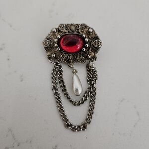 Vintage  filigree brooch with red stone